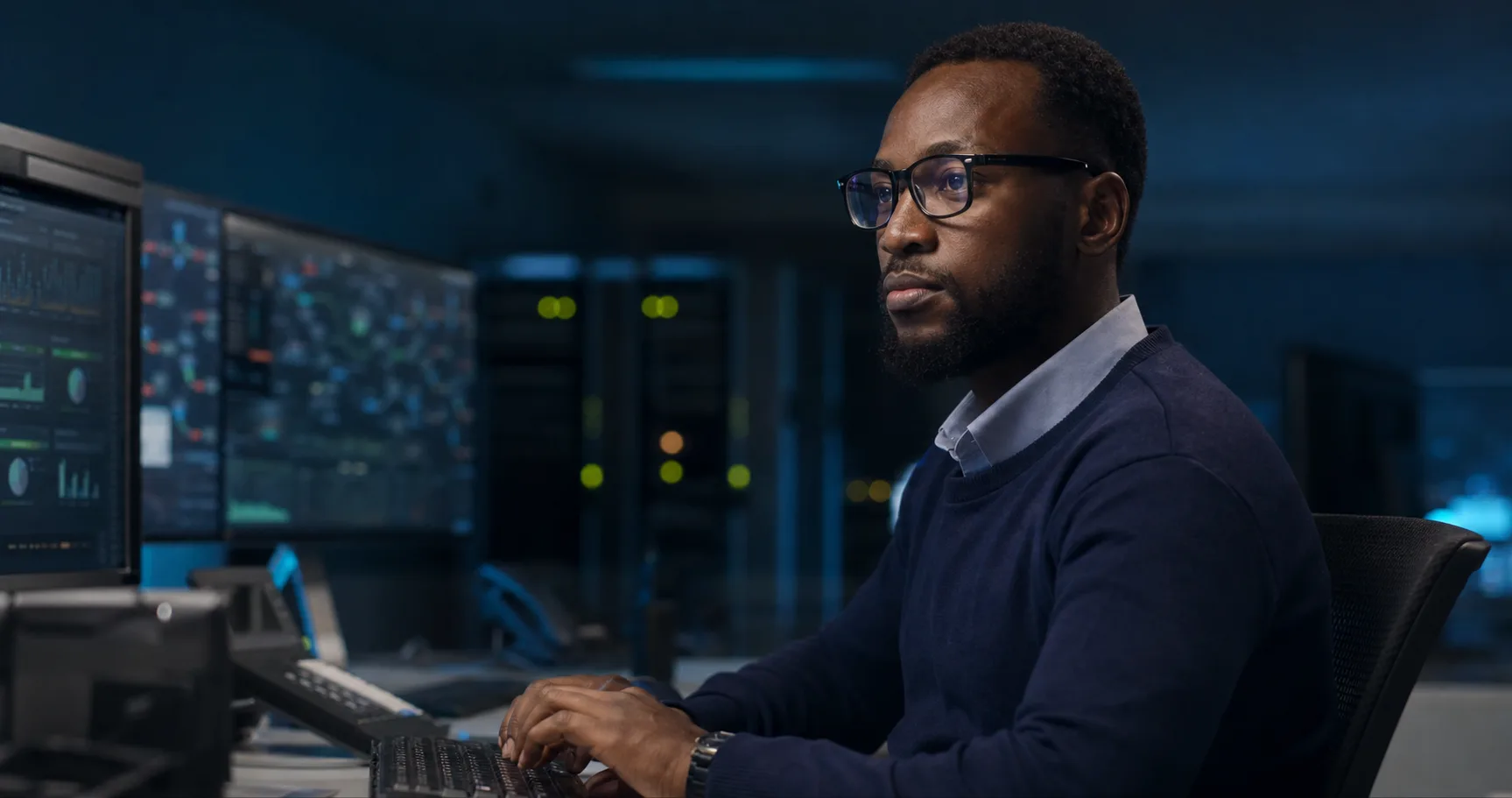 Infrastructure engineer working at a network operations desk